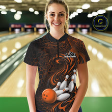 Load image into Gallery viewer, Female model standing in a bowling lane wearing a black and orange bowling quarter-zip shirt featuring a tribal flame bowling ball and pins graphic on the front.