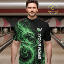 Load image into Gallery viewer, Male model wearing a black bowling quarter-zip shirt in a bowling alley featuring a skull clutching a bowling ball with swirling green energy flames