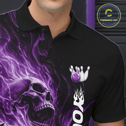 Close-up of the left chest on a black bowling polo shirt featuring a skull clutching a bowling ball surrounded by swirling purple energy flames