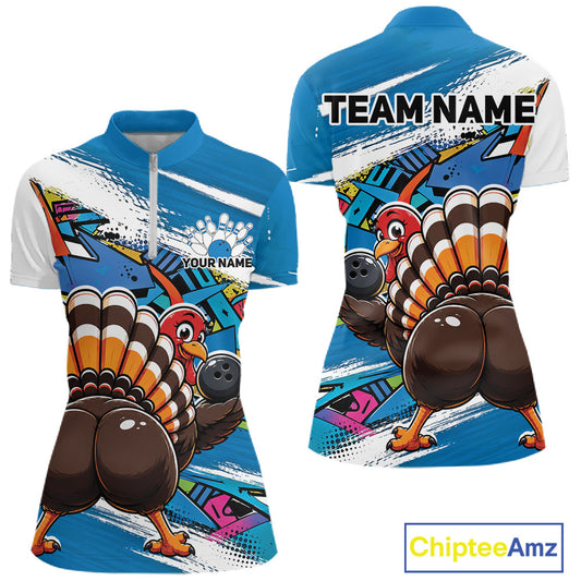 Front and back views of a blue custom women's quarter zip bowling shirt featuring a funny graffiti turkey holding a bowling ball, paint splatter accents, and a personalized name.