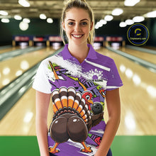 Load image into Gallery viewer, Front view of a female model wearing a purple custom bowling polo shirt with a funny graffiti turkey holding a bowling ball, paint splatter accents, and a personalized name in a bowling alley.