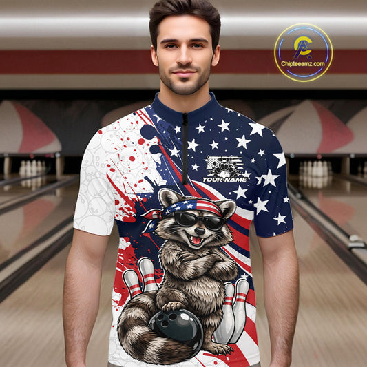 Male model in bowling lane wearing quarter-zip shirt with raccoon sunglasses and patriotic bandana artwork beside bowling ball