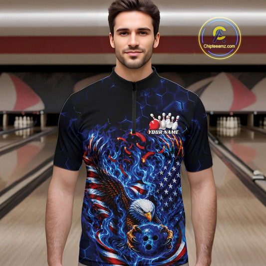 Male model front view at a bowling lane wearing a quarter zip shirt with flaming bald eagle, blue bowling ball, American flag, and blue flames.