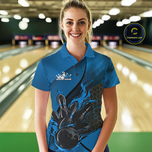 Load image into Gallery viewer, Female model at a bowling lane wearing a black and blue bowling polo shirt with bowling strike artwork and hexagonal pattern details.