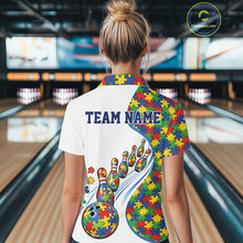 Load image into Gallery viewer, Female model in a bowling lane wearing a white polo shirt, back view featuring colorful autism-themed bowling strikes and puzzle-inspired graphics