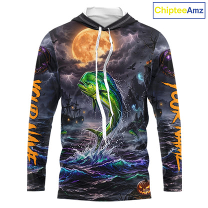A long-sleeve hoodie with an all-over Halloween-themed graphic print featuring a green mahi-mahi fish jumping from dark ocean waves under a large orange full moon, with spooky ships and lightning in the background. The hoodie has white drawstrings and a white inner hood lining, shown on a plain white background with a ChipteeAmz logo in the top right corner.