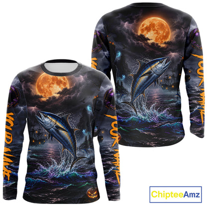 A long-sleeve crewneck shirt shown from both front and back, featuring a dramatic all-over Halloween-style print of a tuna fish jumping from dark ocean water under a large orange full moon, with orange text running down the sleeves and a ChipteeAmz logo in the bottom right corner.
