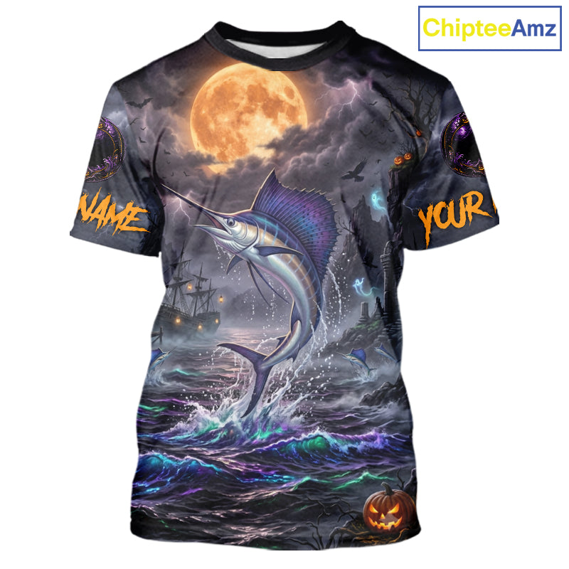 A short-sleeve crewneck t-shirt featuring a full-bleed Halloween graphic print. The design depicts a large marlin jumping from dark, choppy waters under a glowing orange full moon, with a ghost ship in the background and customizable text placeholders 'NAME' and 'YOUR' on the sleeves, along with a jack-o'-lantern at the bottom right.