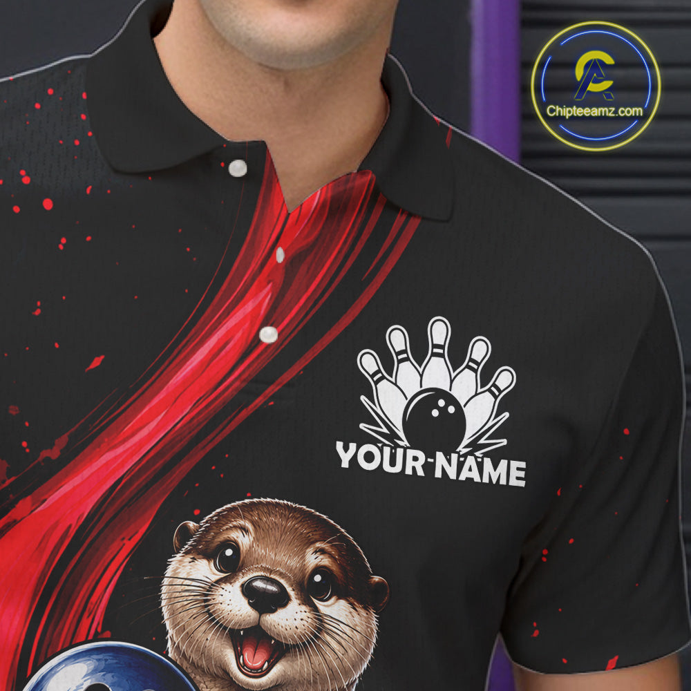 A close-up of a black short-sleeve polo shirt worn by a model, featuring a red abstract graphic, a white bowling pin and ball graphic with the text 'YOUR NAME', and a cartoon otter holding a bowling ball near the bottom. A circular 'Chipteeamz.