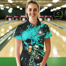 Load image into Gallery viewer, Person wearing a teal bowling shirt with a skeleton design in a bowling alley.