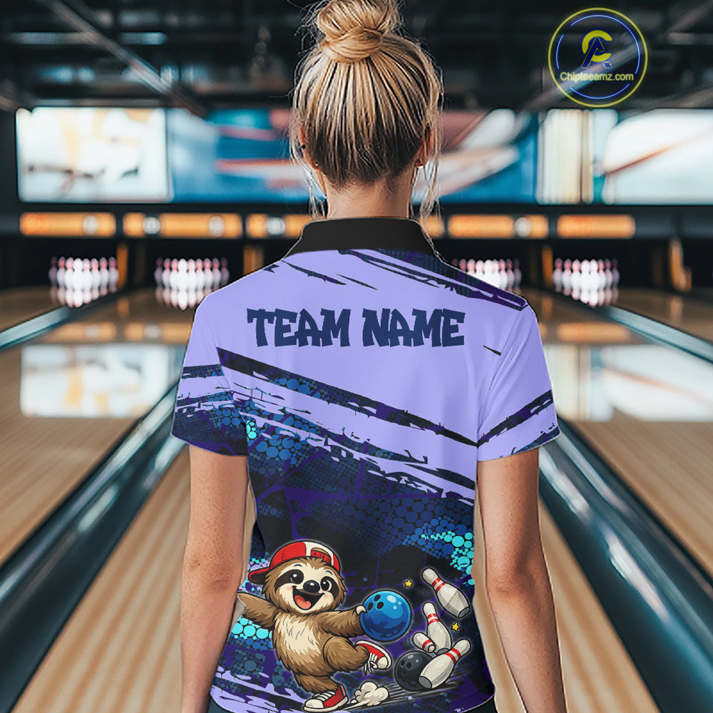 Person wearing a bowling shirt with a sloth graphic in a bowling alley.
