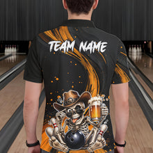 Load image into Gallery viewer, Man wearing a black and Yellow bowling-themed shirt with a skeleton design in a bowling alley.