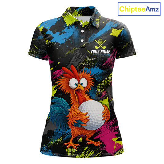 A women's short-sleeve polo shirt with a vibrant, colorful all-over print featuring a cartoon rooster holding a golf ball. The shirt has a black base with bright splashes of blue, pink, yellow, and green, and includes a customizable name and logo print on the chest.