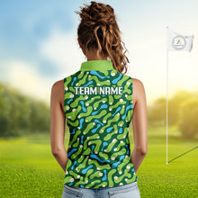 Load image into Gallery viewer, Woman wearing a green patterned sleeveless shirt on a golf course with a flag in the background.