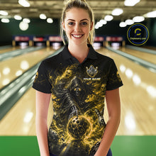 Load image into Gallery viewer, Woman wearing a black and yellow shirt with a design of a skeleton holding a bowling ball in a bowling alley.