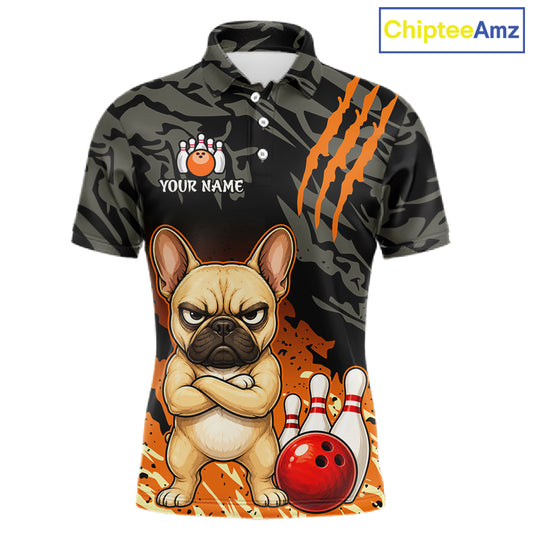 A short-sleeve polo shirt with a dark camouflage pattern, orange claw-strike graphics, and a cartoon French bulldog standing next to bowling pins and a bowling ball. The shirt includes a customizable name print area on the chest.