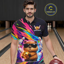 Load image into Gallery viewer, Man wearing a colorful polo shirt with a Funny capybara design in a bowling alley.