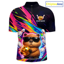 Load image into Gallery viewer, Colorful shirt with a capybara holding a bowling ball and skittles, branded 'ChipteeAmz'.