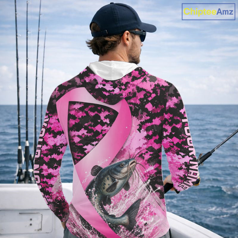 Angler wearing pink ribbon camouflage catfish fishing breast cancer long sleeve hooded sun protection shirt on the water