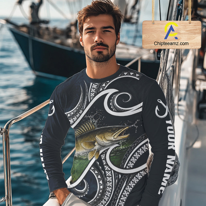 Angler wearing blue tribal pattern custom walleye long sleeve fishing shirt on the water