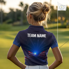 Load image into Gallery viewer, Woman on a golf course wearing a blue polo shirt with 'TEAM NAME' on the back.