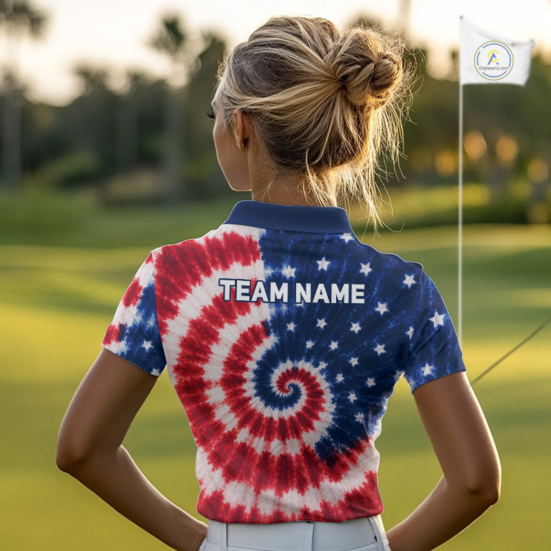 Woman wearing an American flag tie dye womens golf polo shirt and 'Team Name' text on the back, standing on a golf course.