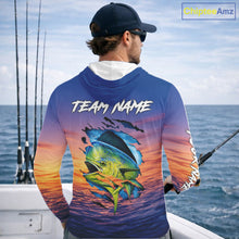 Load image into Gallery viewer, Angler wearing Mahi Mahi Fishing Sunset custom long sleeve hooded mahi mahi offshore fishing shirt on the boat at sunset