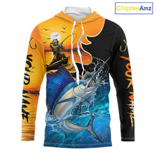 Load image into Gallery viewer, Long sleeve hooded fishing shirt with a fish reaper and sailfish design on a sunset background