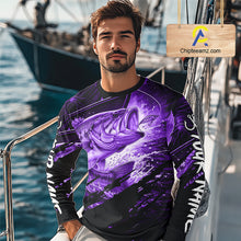Load image into Gallery viewer, Man wearing a long sleeve fishing shirt with a purple bass fish design on a boat
