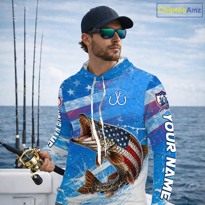 Man wearing a patriotic northern pike fishing shirt with custom name, holding a fishing rod on a boat.