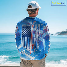 Load image into Gallery viewer, Man on a boat wearing a blue American flag marlin fishing shirt with custom name on the sleeves