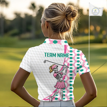 Person wearing a white polo shirt with a skeleton golfer design on a golf course