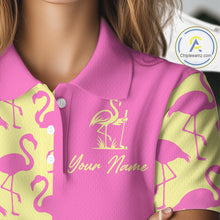 Load image into Gallery viewer, Close-up of pink and yellow flamingos pattern on women’s golf polo shirt