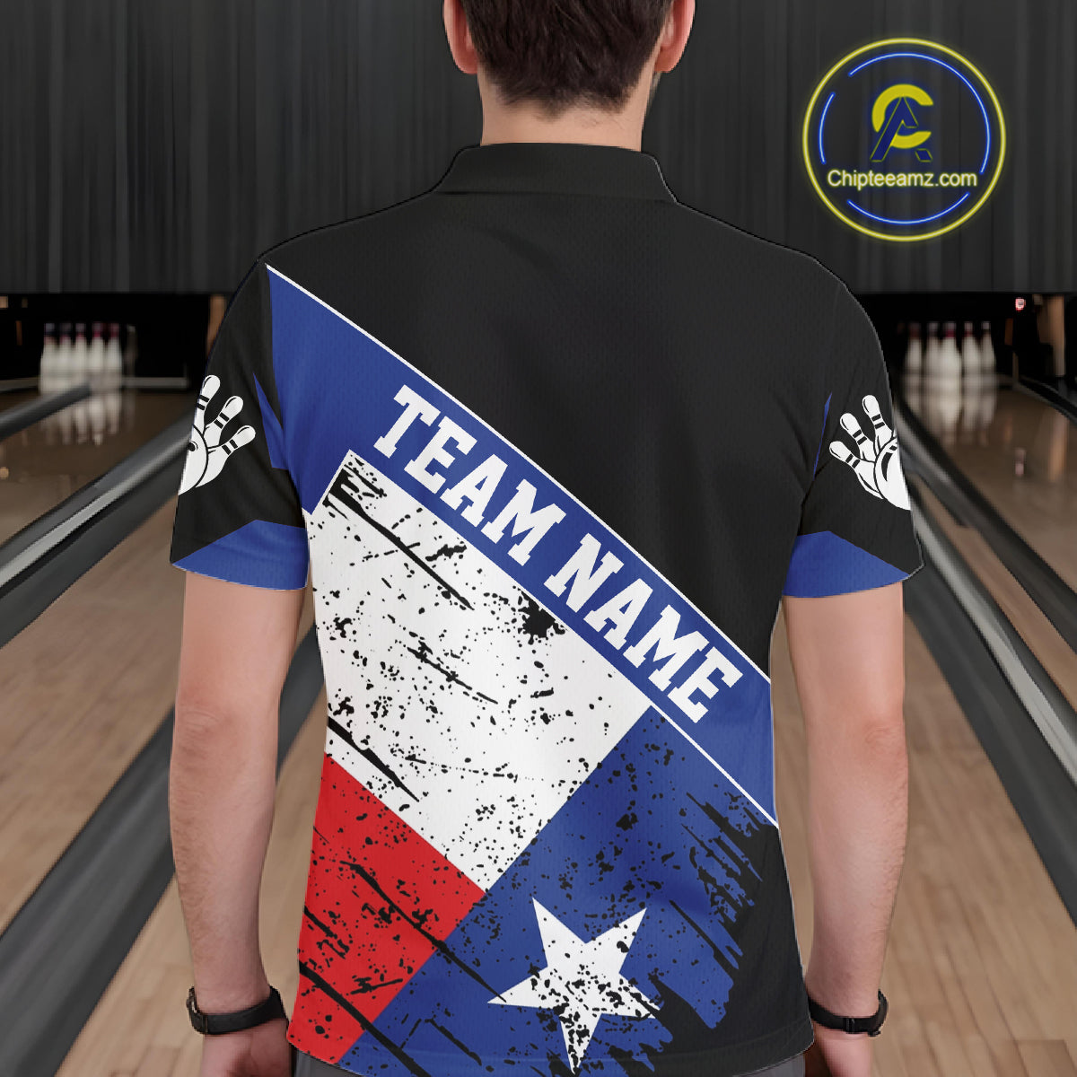 Back view of man wearing a grunge Texas flag bowling polo shirt inside a bowling alley.