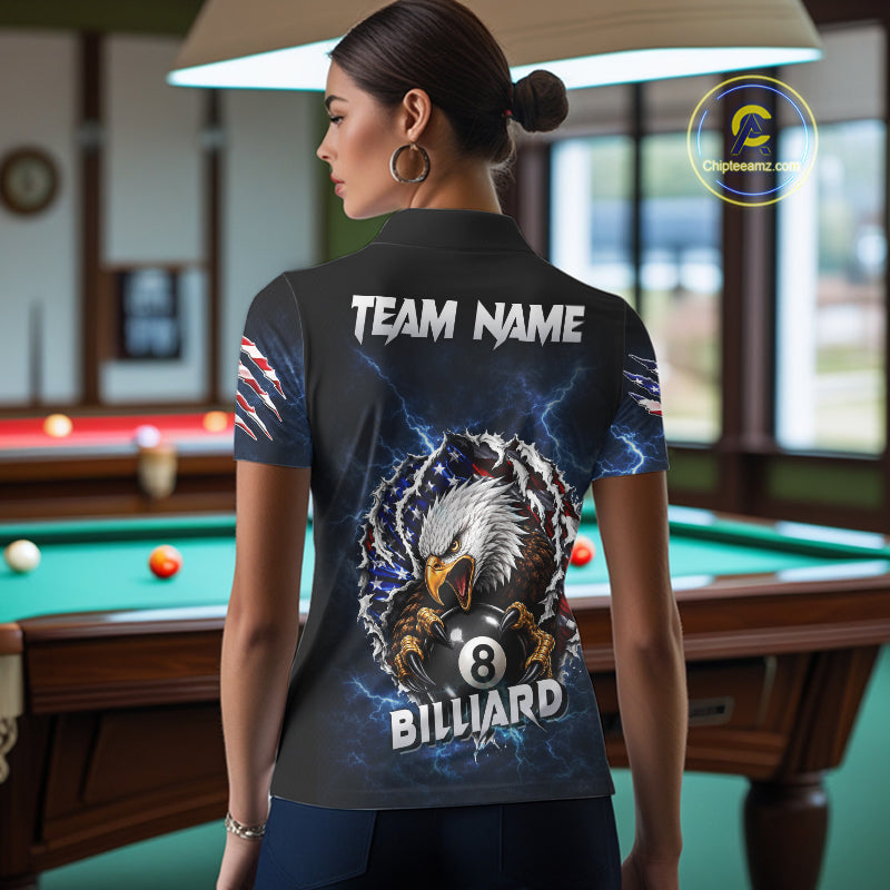 Woman wearing a blue lightning American flag eagle 8 ball billiard jersey beside a pool table front view.