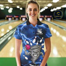 Load image into Gallery viewer, Woman wearing a blue thunder lightning tornado bowling polo shirt at a bowling alley front view.