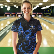 Load image into Gallery viewer, Woman wearing black and blue phoenix wings bowling polo shirt front view.