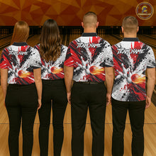 Load image into Gallery viewer, Back view of bowling team wearing matching red splatter bowling shirts in a bowling alley.