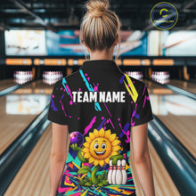 Load image into Gallery viewer, Back view of woman wearing a colorful sunflower bowling polo shirt inside a bowling alley.