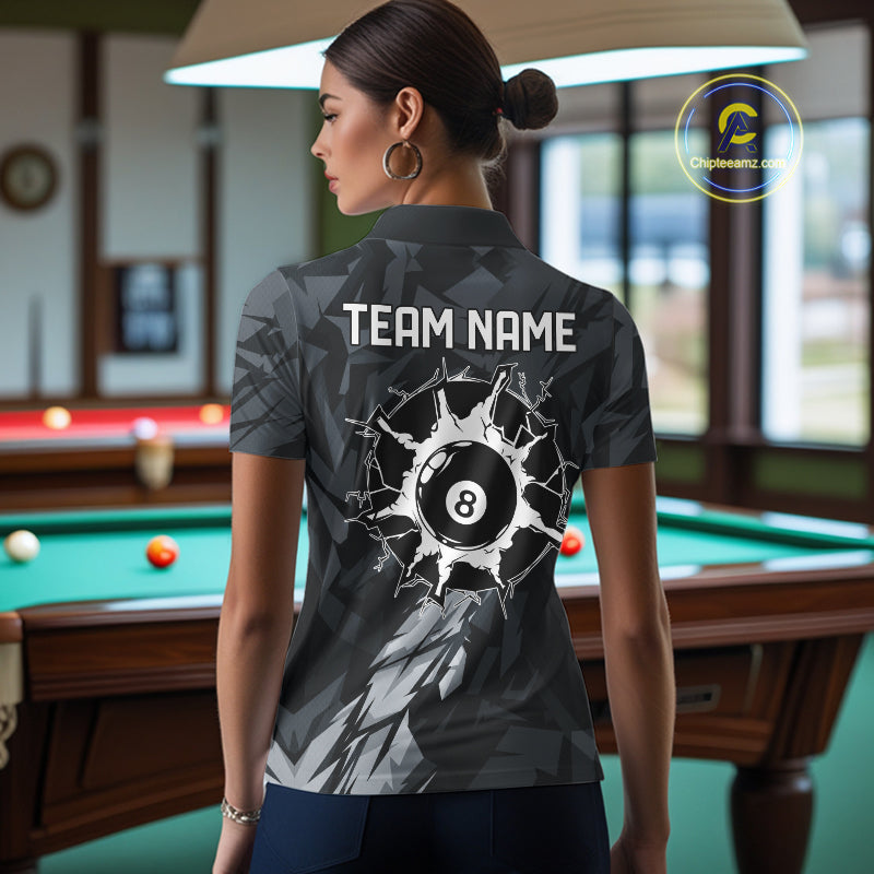 Back view of woman wearing a black and grey pool team shirt in a billiards hall.
