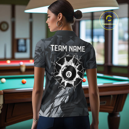 Back view of woman wearing a black and grey pool team shirt in a billiards hall.
