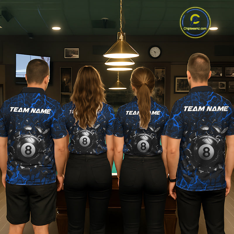 Back view of pool players wearing matching blue crack billiard shirts in a game room.