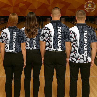 Back view of bowling team wearing matching blue tribal bowling shirts in a bowling alley.
