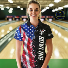 Load image into Gallery viewer, Woman wearing an American flag bowling polo shirt at a bowling alley front view.