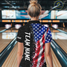 Load image into Gallery viewer, Back view of woman wearing an American flag bowling polo shirt inside a bowling alley.