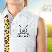 Load image into Gallery viewer, White sleeveless golf shirt with golf club and ball design, personalized with 'Your Name', on a blurred golf course background.