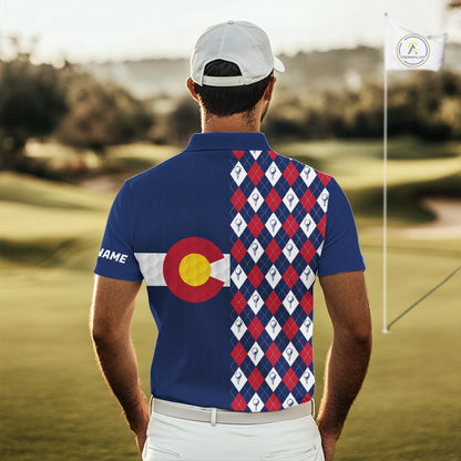 Male golfer wearing Colorado flag golf polo at scenic mountain golf course, perfect for golf vacations, outdoor adventure and state pride.